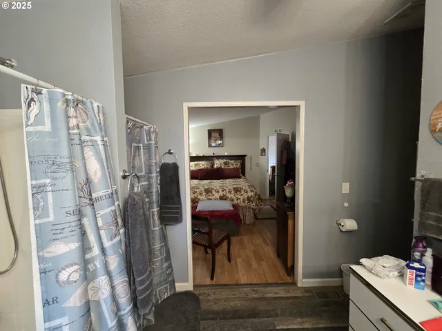 a view of living room with furniture and wooden floor