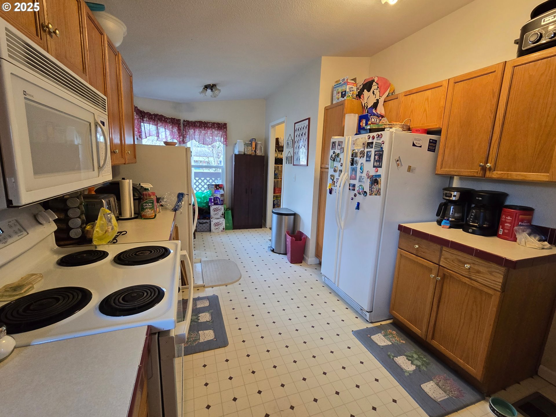 3200 Oak Terrace Drive, Unit 47 Lebanon, OR 97355 - Photo 19 of 24 a kitchen with a refrigerator and a stove