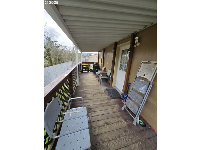 a view of living room with furniture and wooden floor
