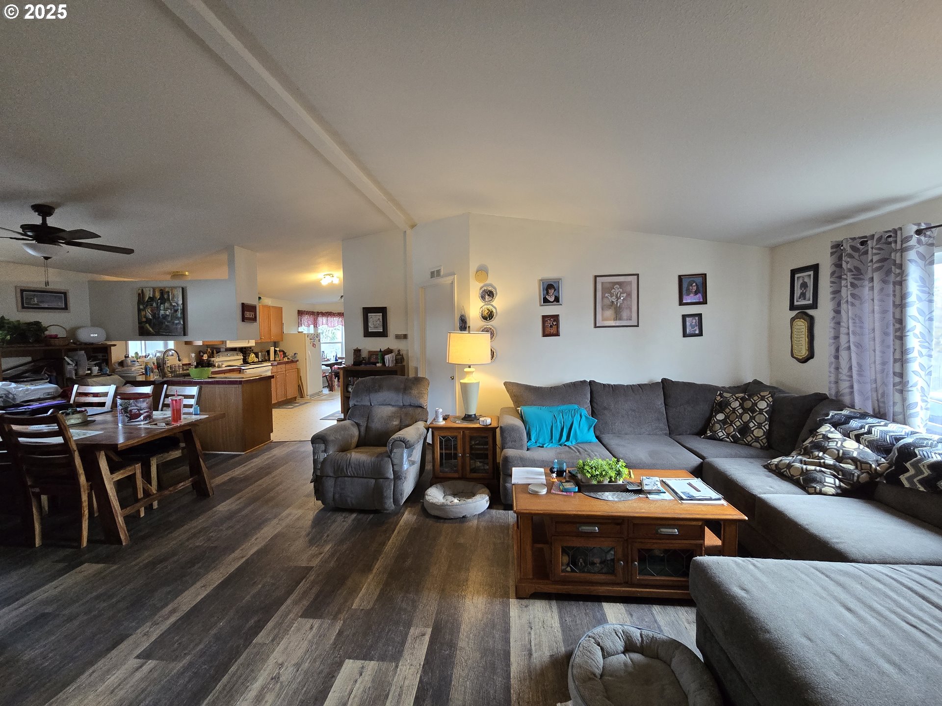 3200 Oak Terrace Drive, Unit 47 Lebanon, OR 97355 - Photo 3 of 24 a living room with furniture kitchen view and a window