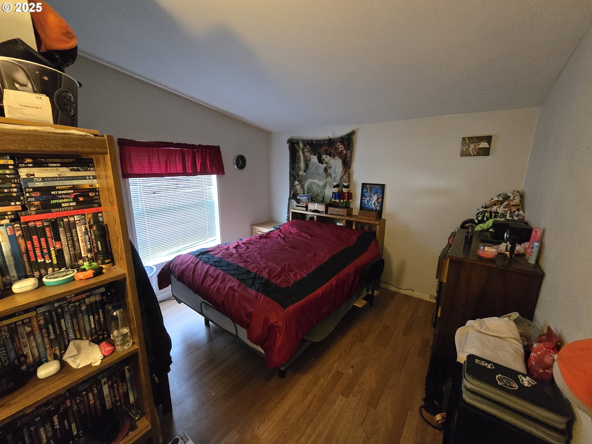 3200 Oak Terrace Drive, Unit 47 Lebanon, OR 97355 - Photo 10 of 24 a bedroom with furniture and a book shelf