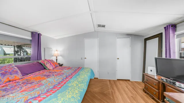 a view of walk in closet with clothes