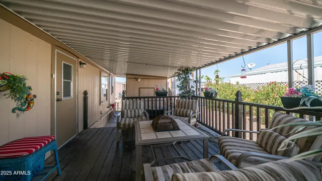 a view of balcony with wooden floor