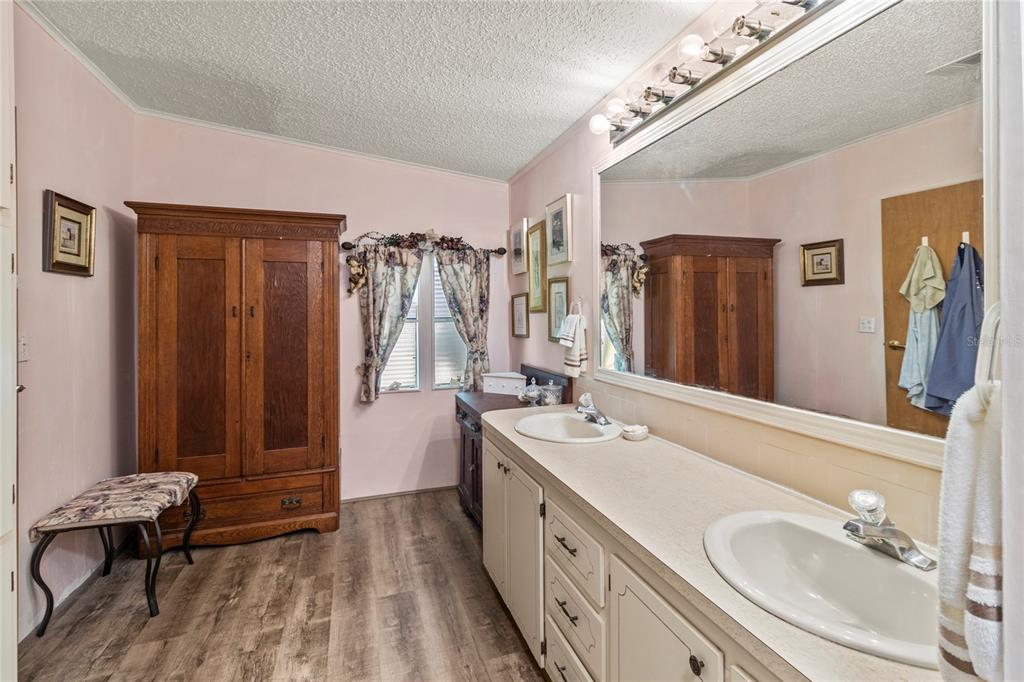 83 Eagle Circle Ellenton, FL 34222 - Photo 29 of 60 a spacious bathroom with a double vanity sink a mirror and shower