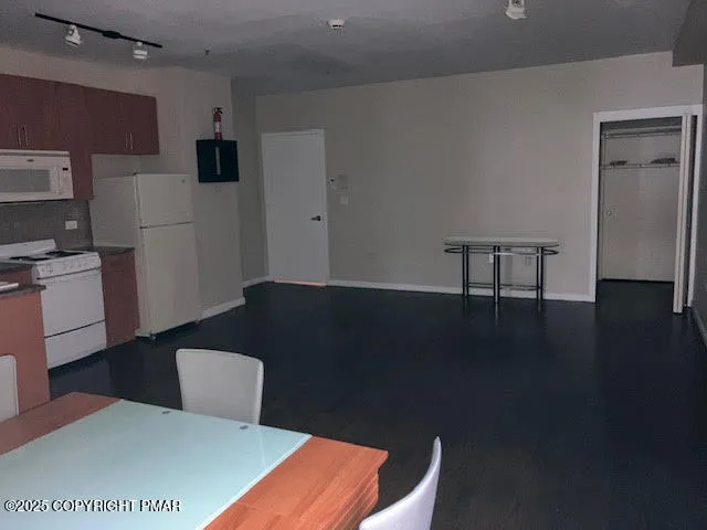 a workspace with furniture and wooden floor