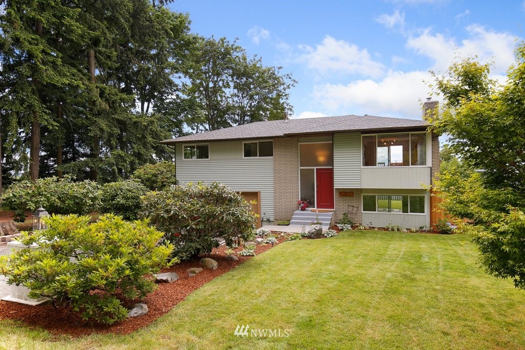 1015 Jones Avenue South Renton, WA 98057 - Photo 2 of 40 a view of a house with a yard garage and sitting area