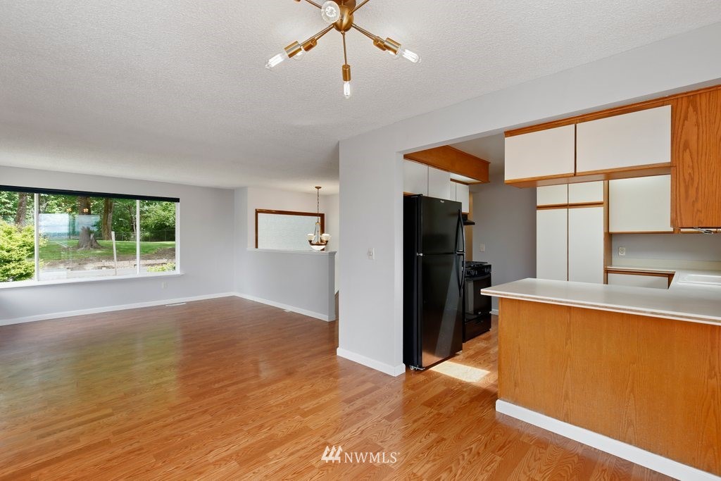 1015 Jones Avenue South Renton, WA 98057 - Photo 18 of 40 a view of a kitchen with a sink and a refrigerator