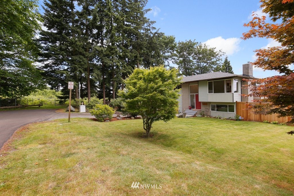 1015 Jones Avenue South Renton, WA 98057 - Photo 3 of 40 a view of swimming pool with a bench and trees