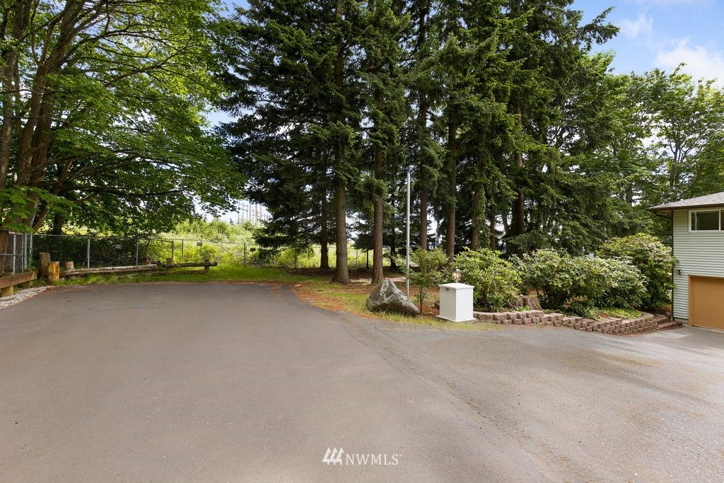 1015 Jones Avenue South Renton, WA 98057 - Photo 4 of 40 a view of a street with trees