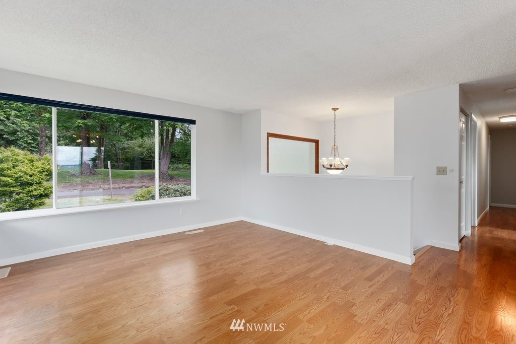 1015 Jones Avenue South Renton, WA 98057 - Photo 9 of 40 a view of empty room with wooden floor and fan