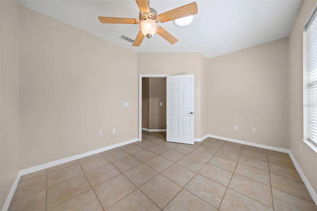 8713 Southwest 83rd Court Road Ocala, FL 34481 - Photo 18 of 23 a view of an empty room with a window