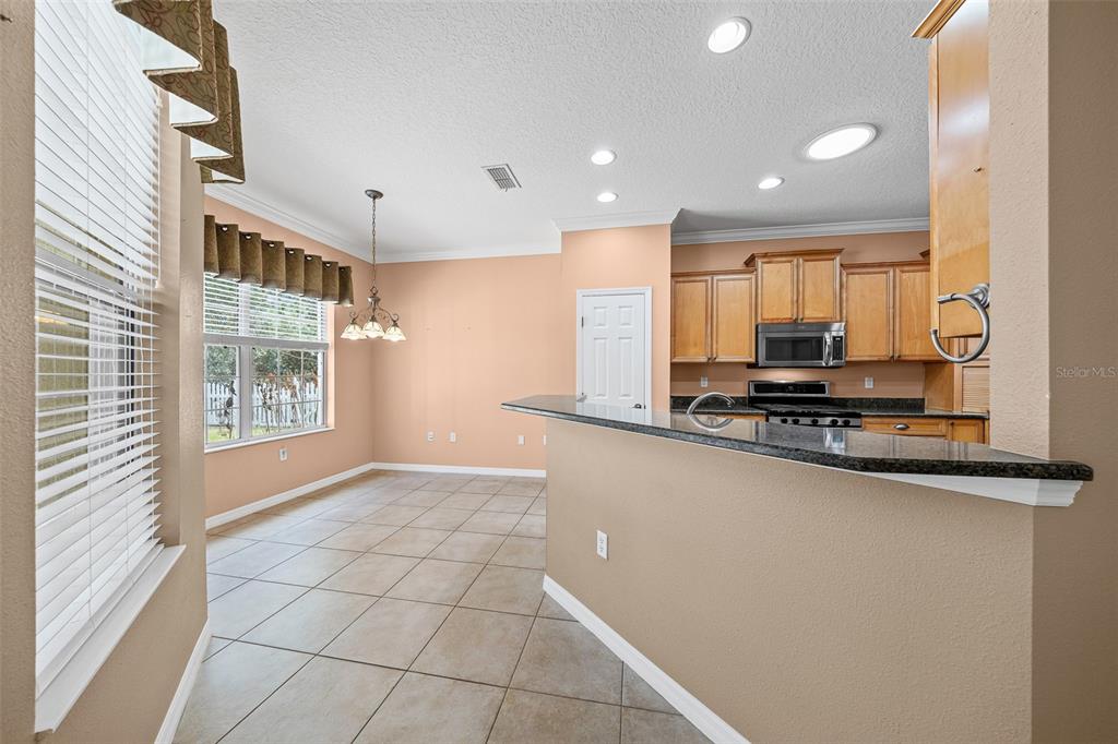 8713 Southwest 83rd Court Road Ocala, FL 34481 - Photo 9 of 23 a view of kitchen with windows
