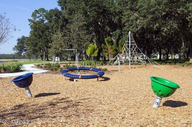 312 Clarys Run St. Augustine, FL 32092 - Photo 13 of 26 a swimming pool with outdoor seating and trees
