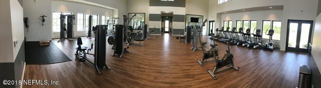 312 Clarys Run St. Augustine, FL 32092 - Photo 9 of 26 a hallway with wooden floor