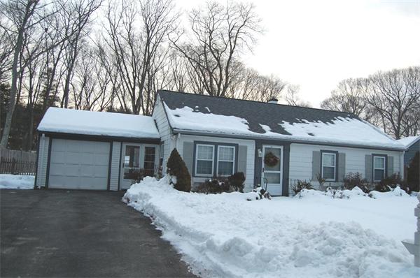 a view of a house with a yard and garage