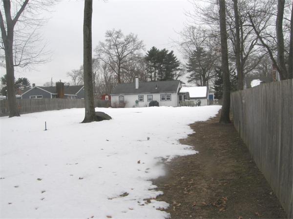 29 Birchcroft Road Canton, MA 02021 - Photo 3 of 3 a view of a yard with snow on the road