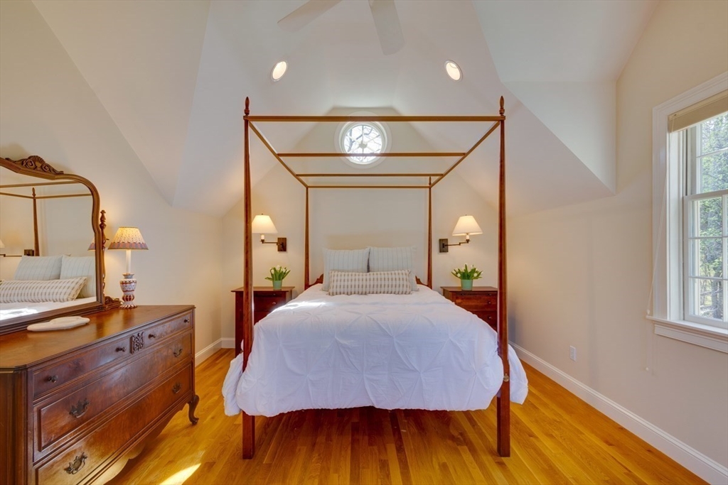 180 Highgate Street Needham, MA 02492 - Photo 19 of 31 a bedroom with a bed and wooden floor