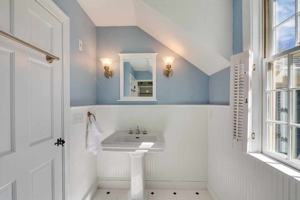 180 Highgate Street Needham, MA 02492 - Photo 21 of 31 a bathroom with a sink a mirror and shower