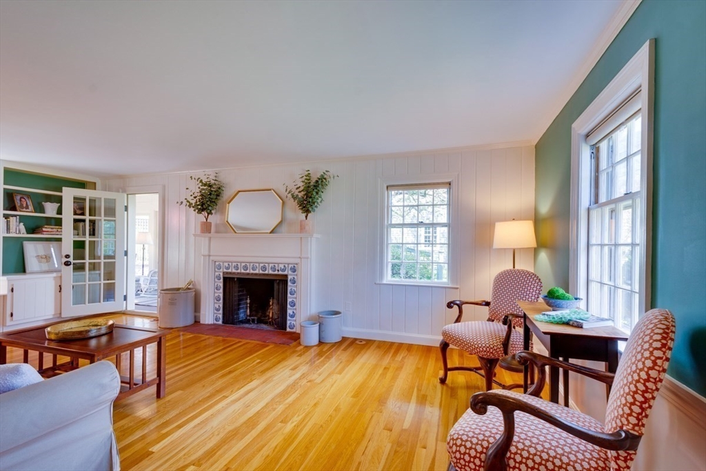 180 Highgate Street Needham, MA 02492 - Photo 4 of 31 a living room with furniture fireplace and window