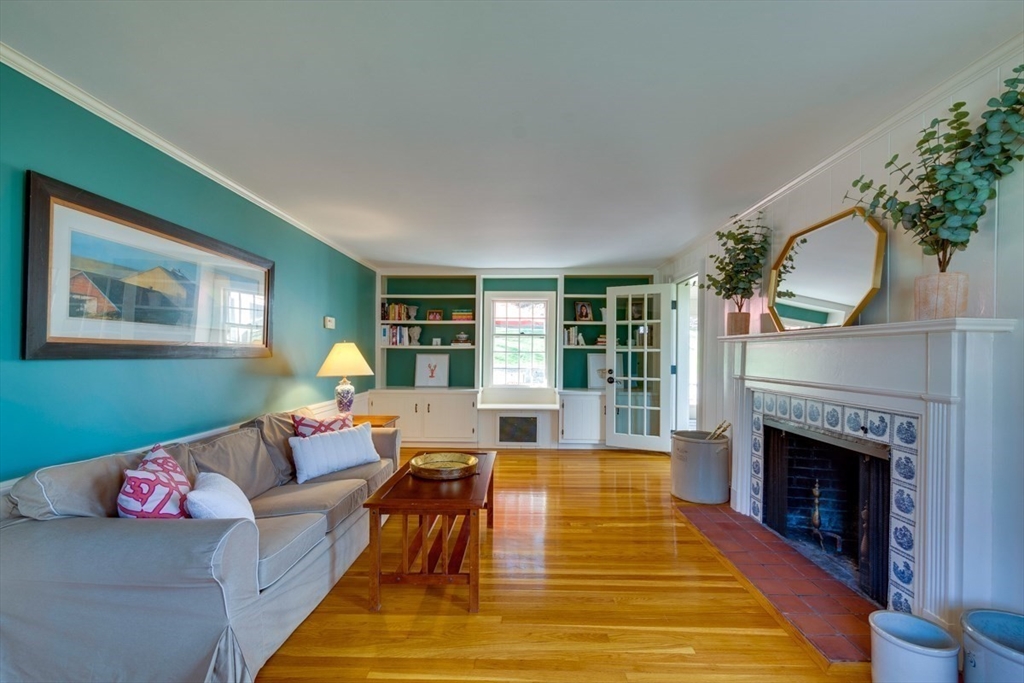 180 Highgate Street Needham, MA 02492 - Photo 5 of 31 a living room with furniture and a fireplace