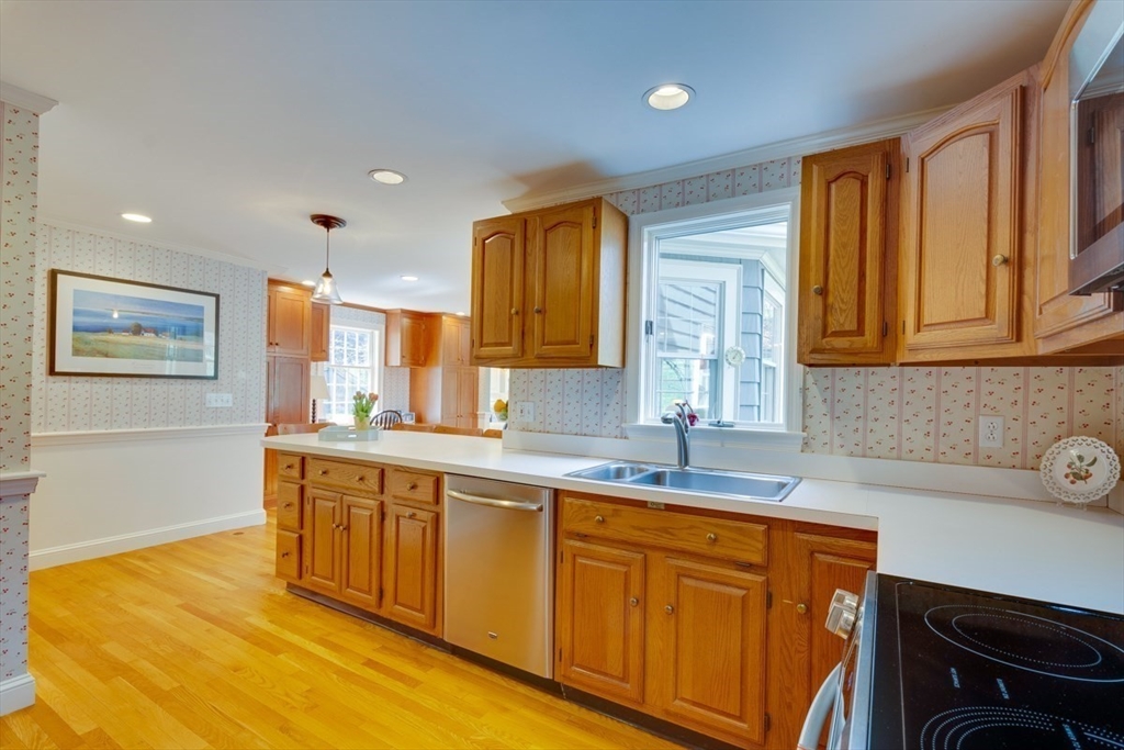 180 Highgate Street Needham, MA 02492 - Photo 8 of 31 a kitchen with stainless steel appliances granite countertop a sink and cabinets