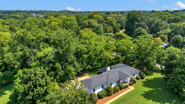 an aerial view of a house with mountain view