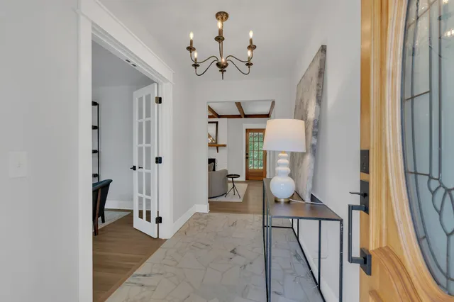 a view of a hallway view with staircase