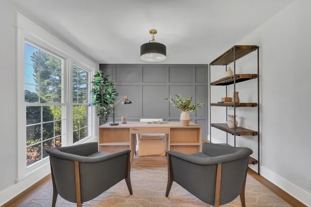 a dining room with furniture and window