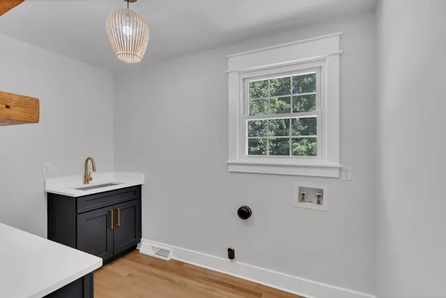a view of a bathroom with a sink and a window