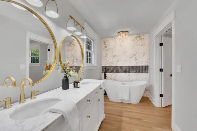 a living room with furniture and a large mirror