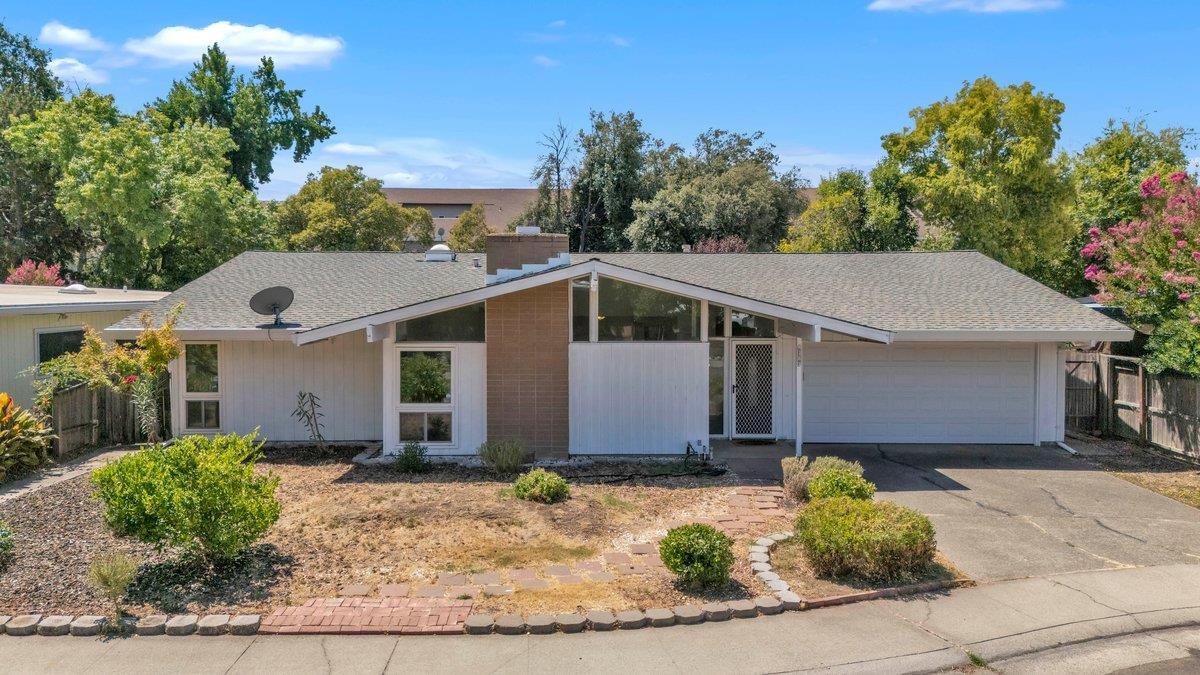 a front view of a house with garden