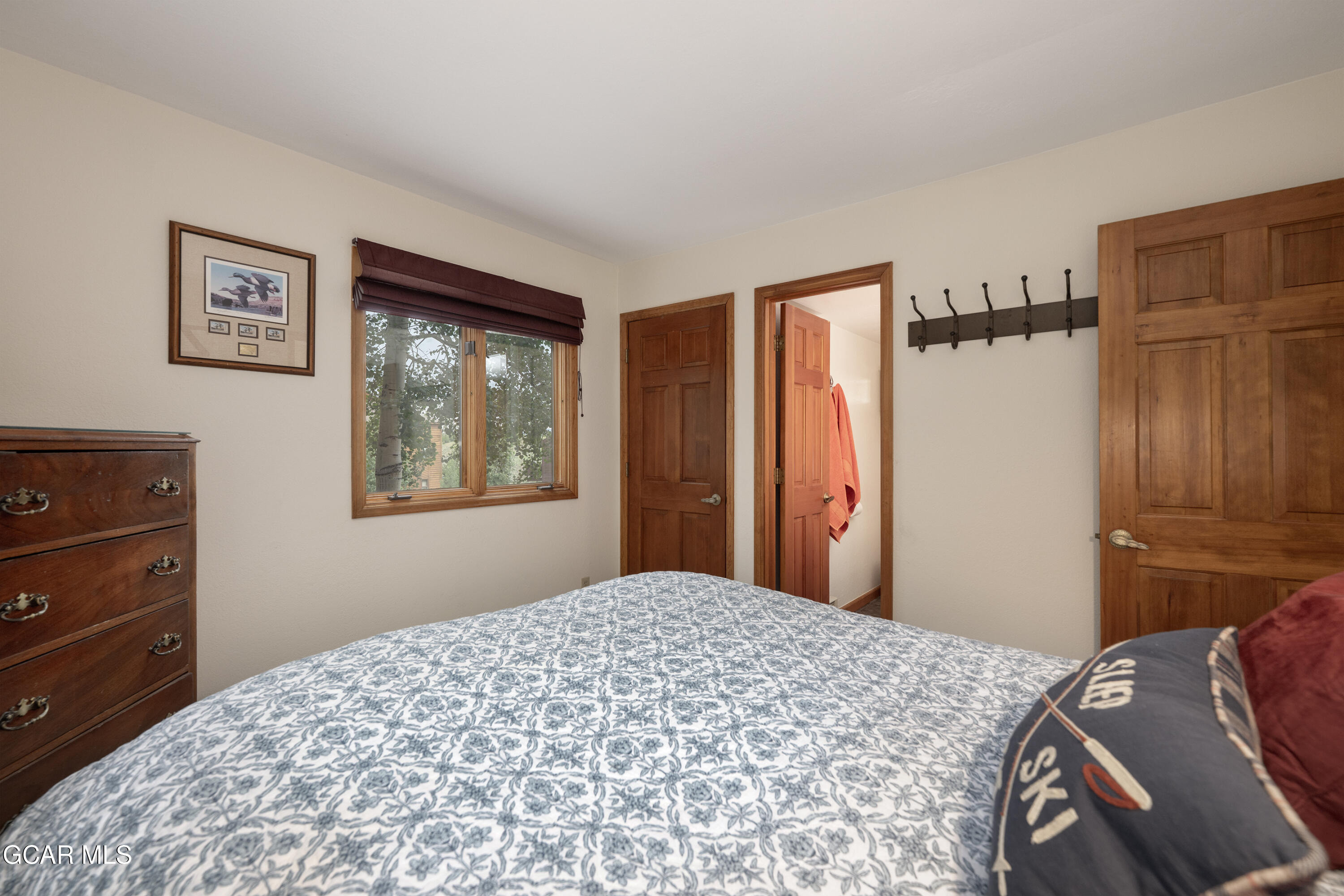 820 Wolverine Lane, Unit 3 Fraser, CO 80442 - Photo 32 of 43 a bedroom with a bed and a window