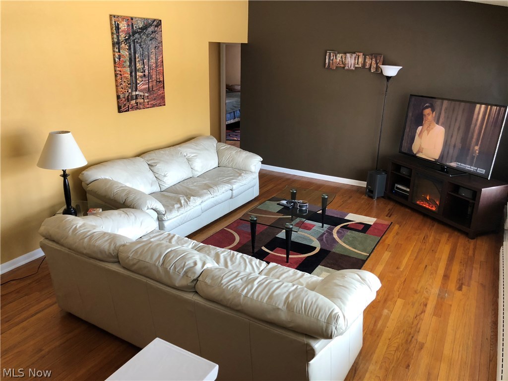9420 David Road Cleveland, OH 44125 - Photo 3 of 23 Vaulted Living Room with hardwood floors.