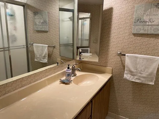 a bathroom with a sink and a mirror