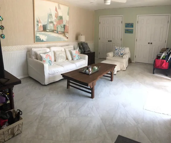 a living room with furniture and a window