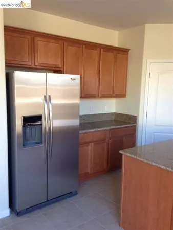 a kitchen with cabinets and stainless steel appliances