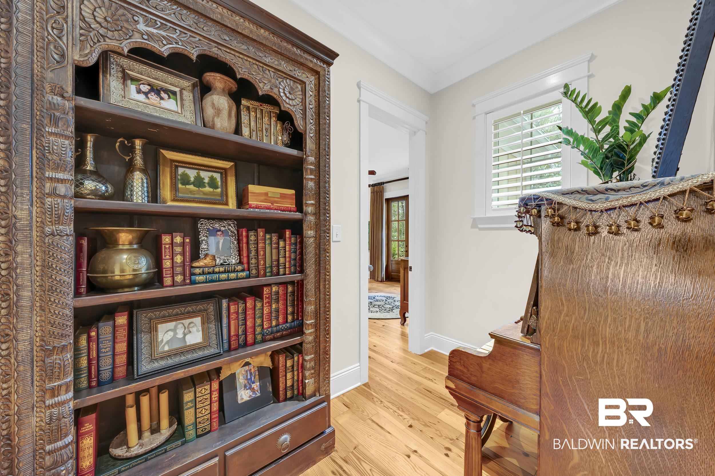 12161 Jessamine Street Magnolia Springs, AL 36555 - Photo 23 of 70 Living area featuring light wood-style floors and crown molding