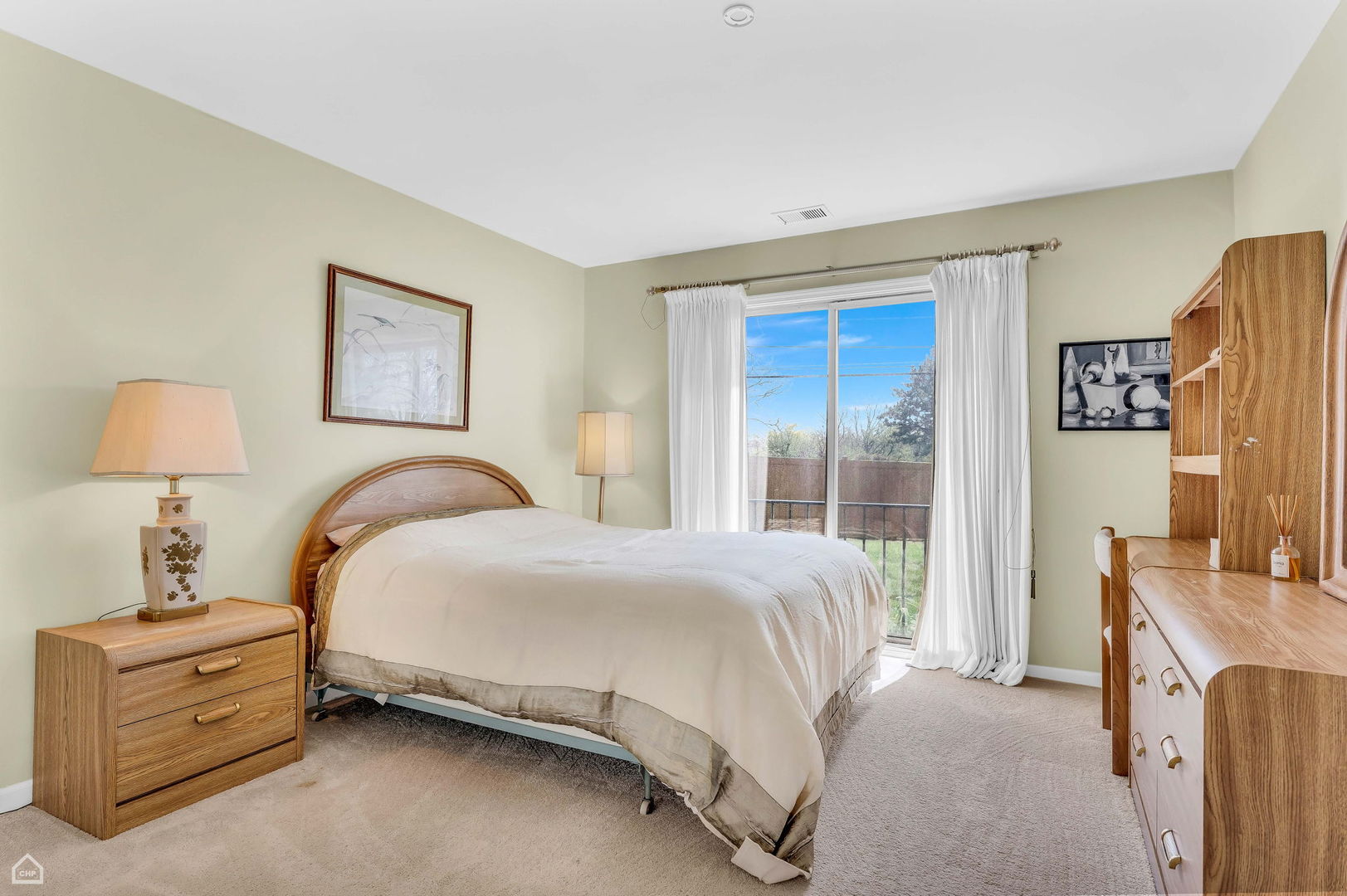4000 Dundee Road, Unit 108 Northbrook, IL 60062 - Photo 18 of 24 a bedroom with a bed and a dresser