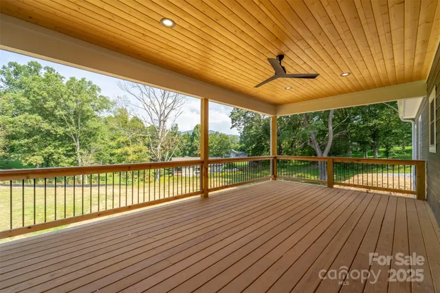 a view of porch with wooden floor