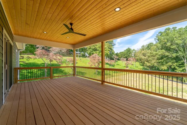 a view of a deck with wooden floor and outdoor space