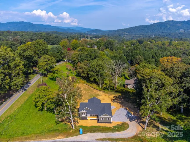 a view of a yard with a swimming pool