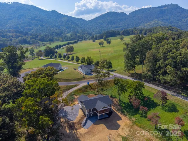 an aerial view of a house with a garden