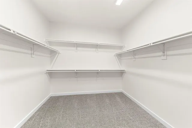 a view of an empty walk in closet