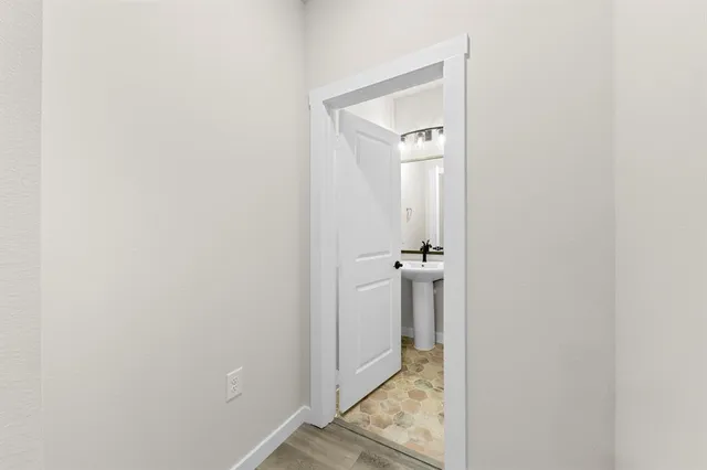 a view of a bathroom from the hallway