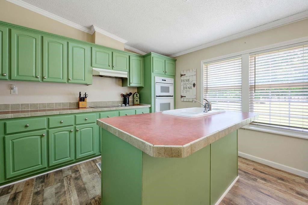 1664 Woodsdale Road Roxboro, NC 27574 - Photo 28 of 50 a kitchen with a sink and cabinets