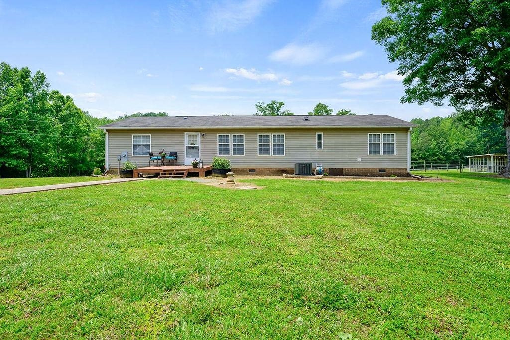 1664 Woodsdale Road Roxboro, NC 27574 - Photo 3 of 50 a front view of house with yard and green space