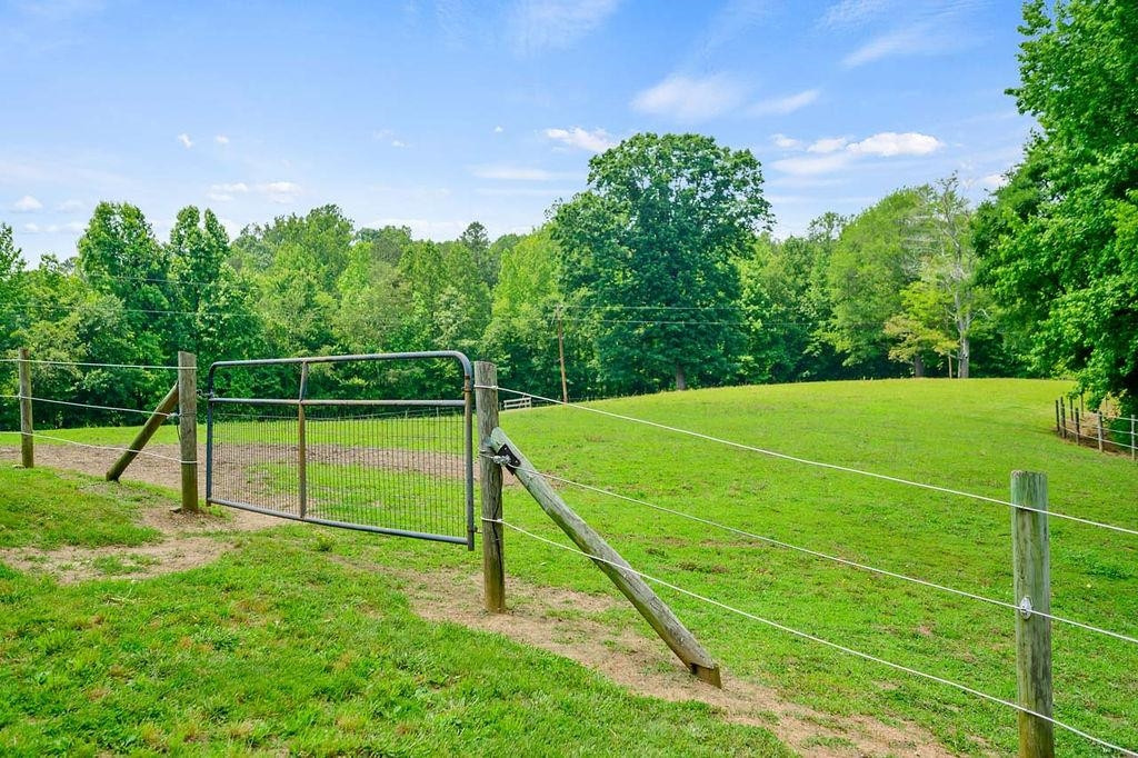 1664 Woodsdale Road Roxboro, NC 27574 - Photo 5 of 50 a view of a tennis ground with a small park