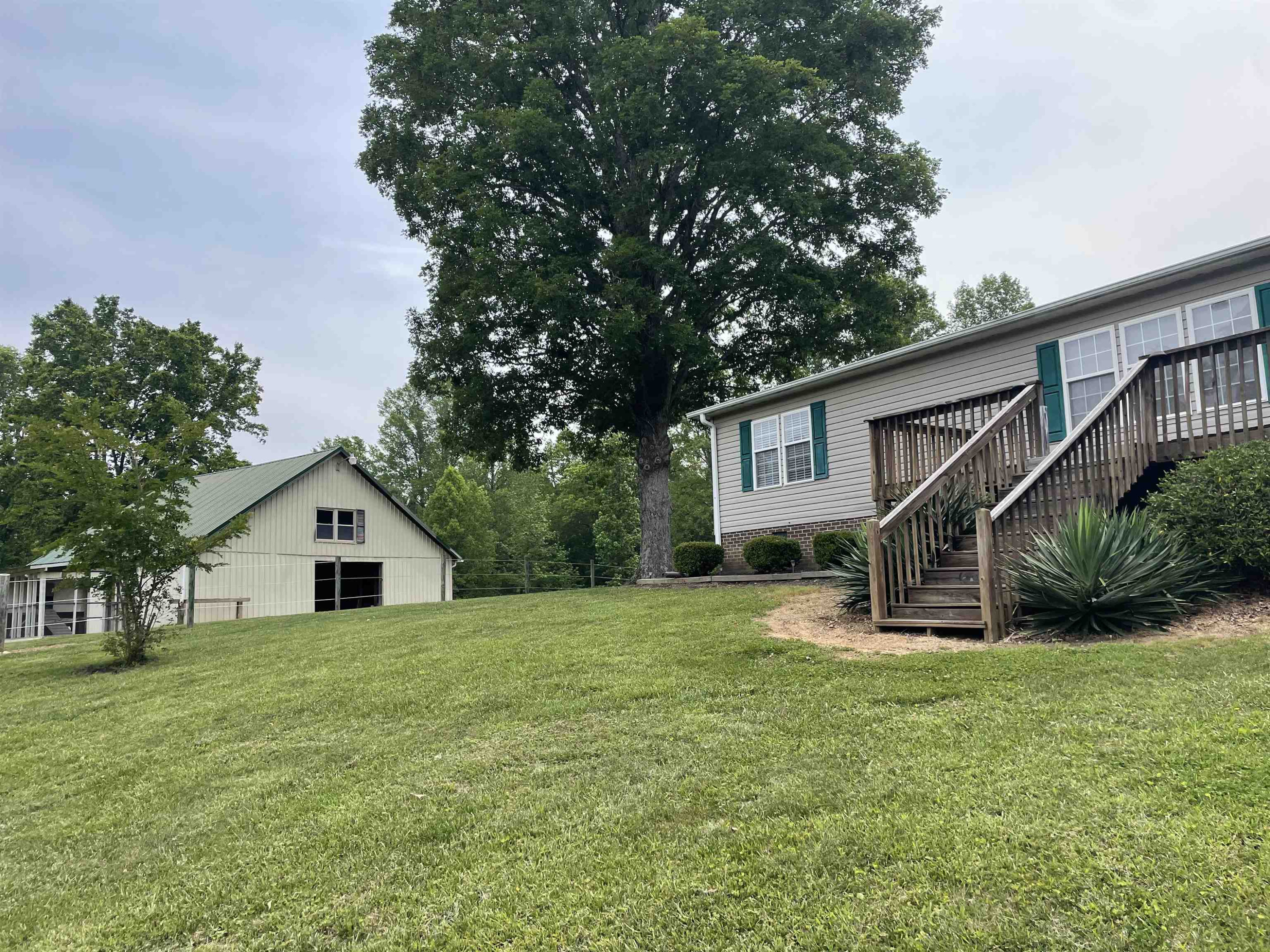1664 Woodsdale Road Roxboro, NC 27574 - Photo 7 of 50 a view of a house with a yard and sitting area