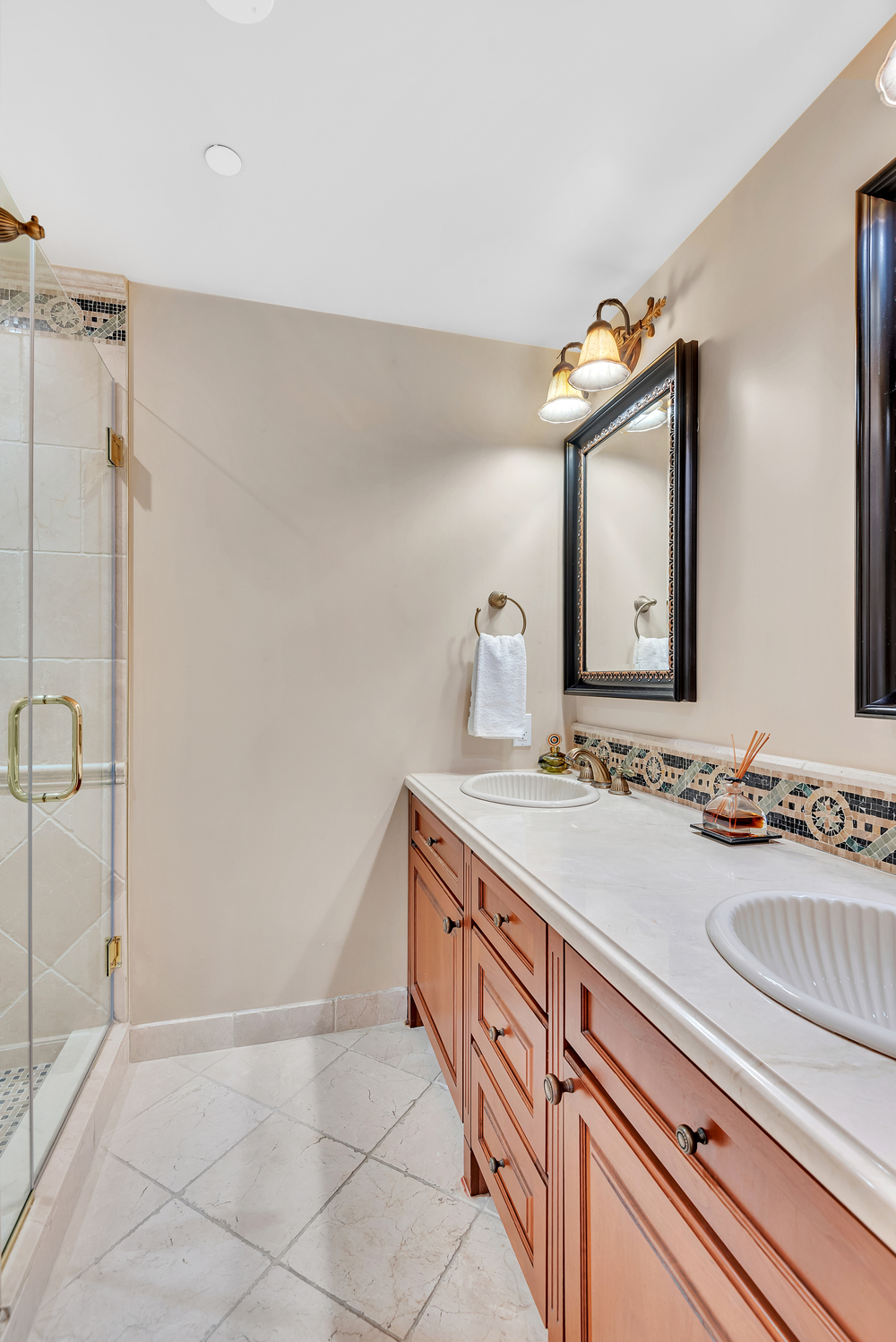 160 Central Park South, Unit 1015/1018 Manhattan, NY 10019 - Photo 12 of 15 a bathroom with a sink and a mirror