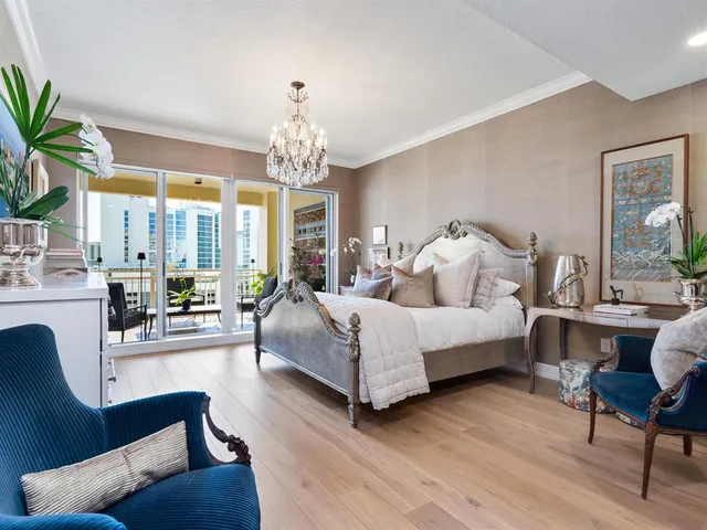 a living room with furniture fireplace and a large window